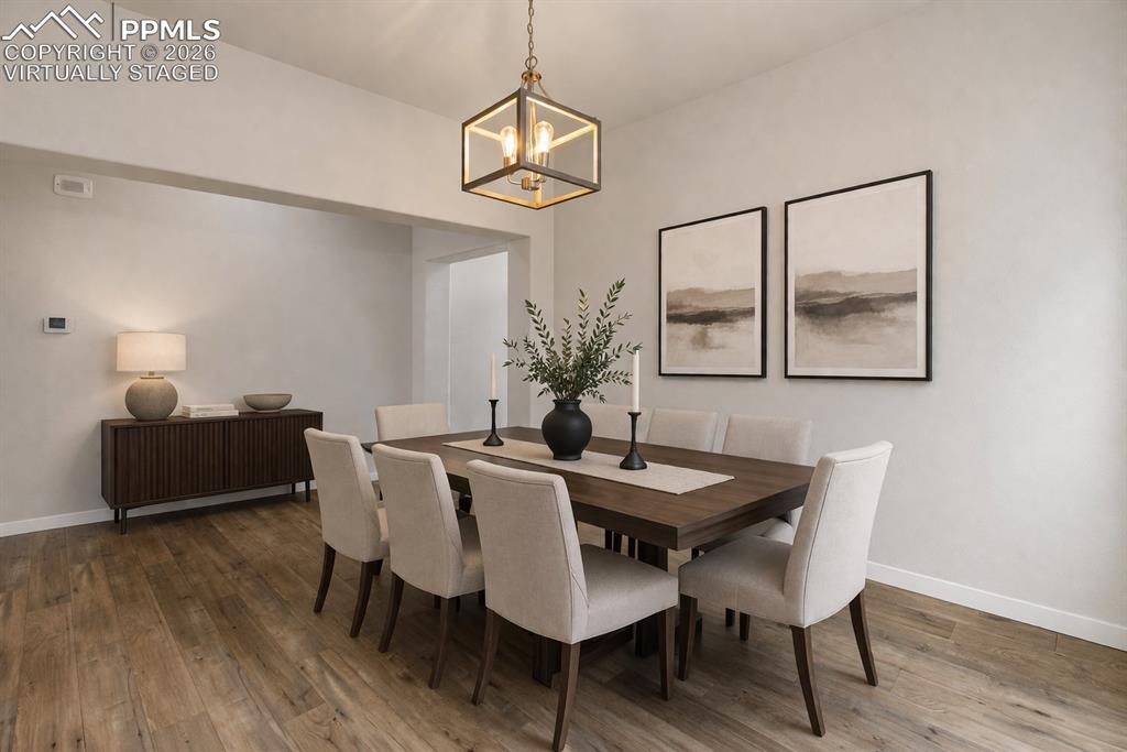 Image 17 of 46: Elegant dining room for memorable gatherings (virtually staged)