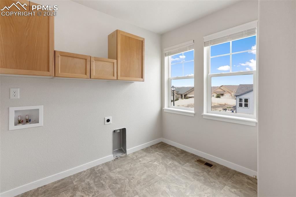 Image 21 of 46: Dedicated laundry space for everyday ease