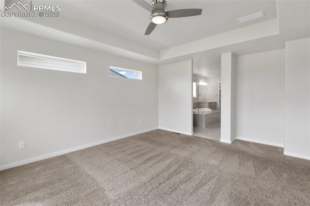 Image 26 of 46: Spacious primary suite with abundant natural light