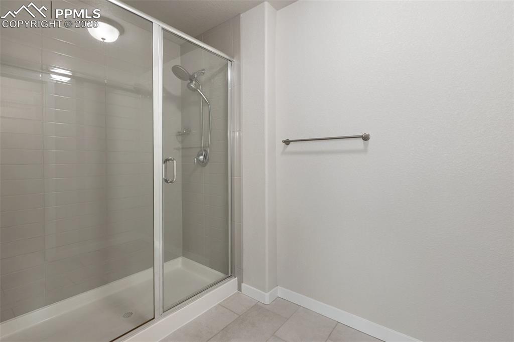 Image 27 of 46: Spacious primary bathroom with modern feel