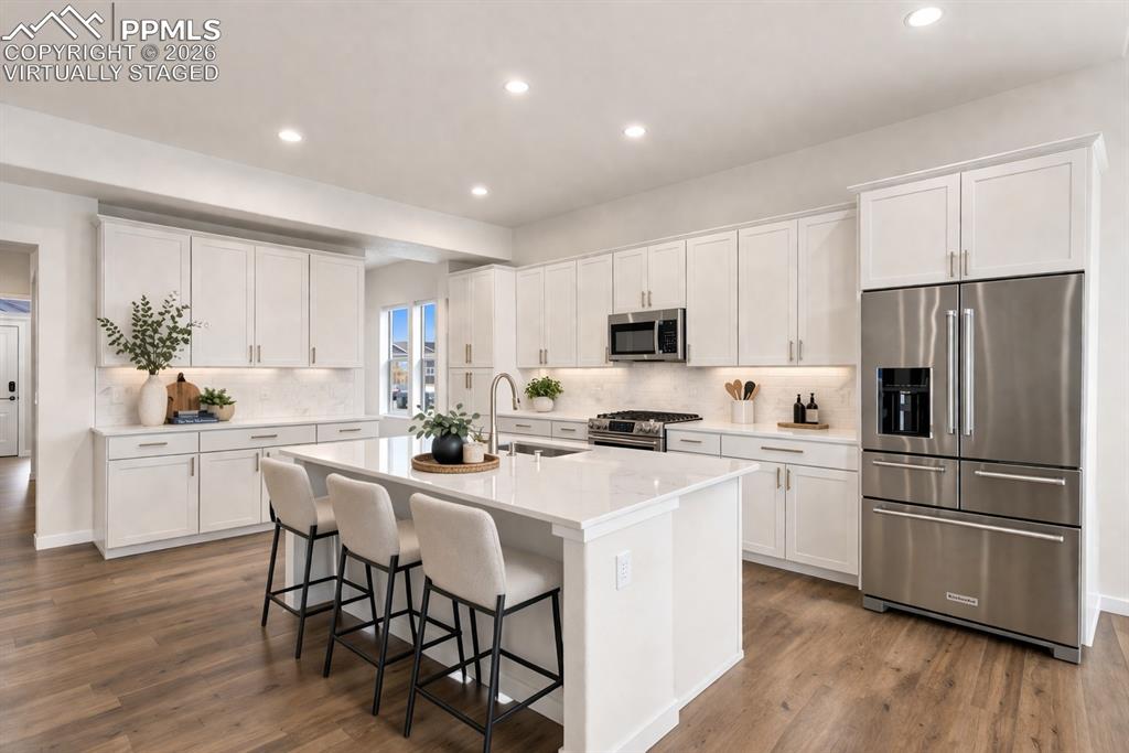 Image 3 of 46: Bright kitchen with large center island (virtually staged)