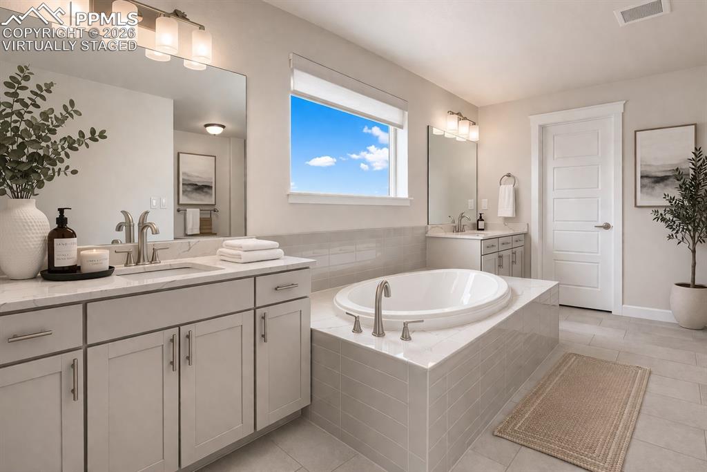 Image 5 of 46: Spa-like primary bath with clean finishes (virtually staged)