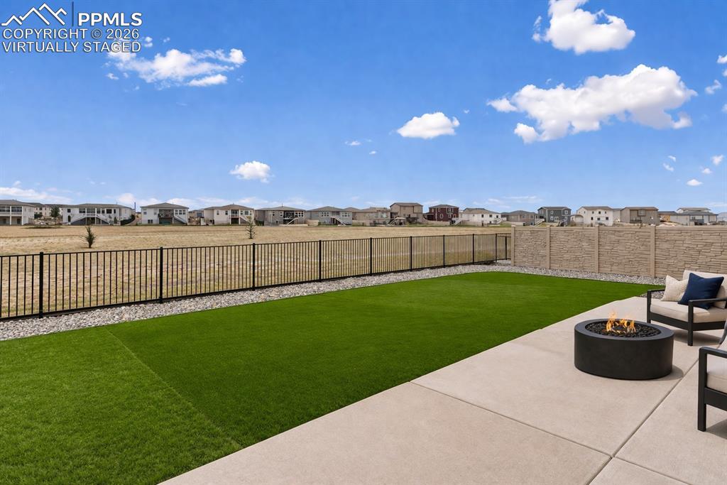 Image 7 of 46: Open yard perfect for relaxing outdoors (virtually staged)