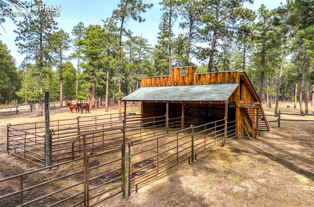 Image 17 of 45: NO HOA! Surrounded by meadow and mature trees, the property is thoughtfully