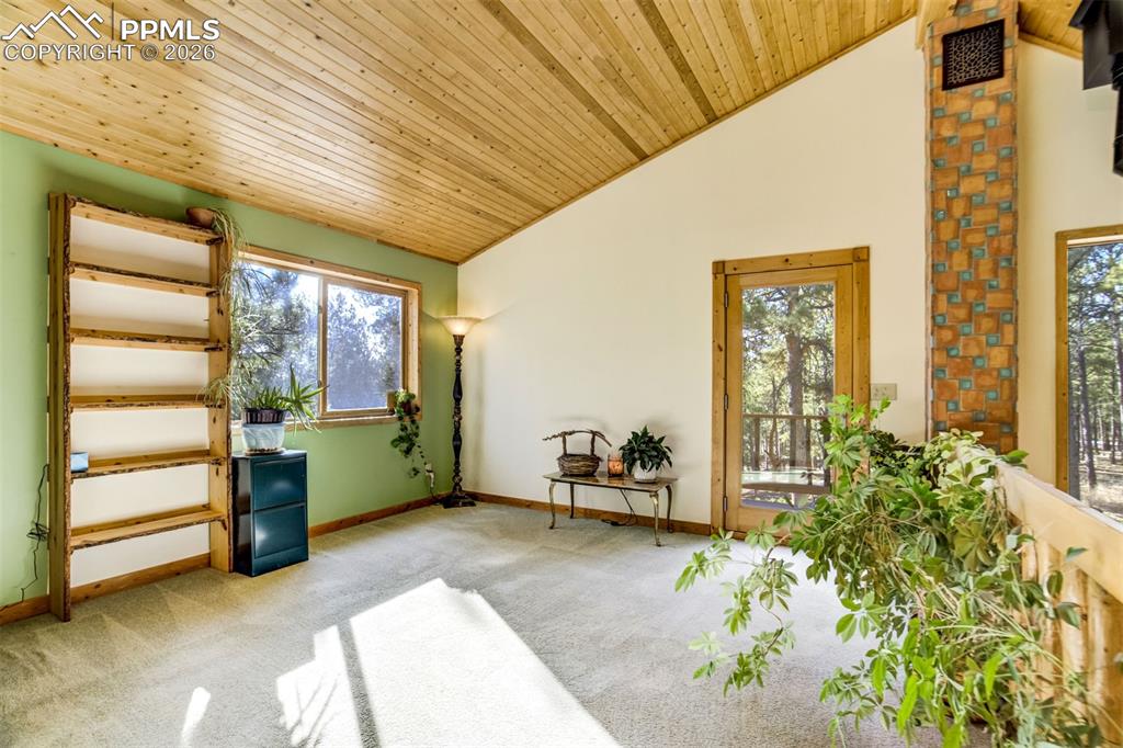 Image 25 of 45: Office, loft, playroom, den walks out to private balcony.