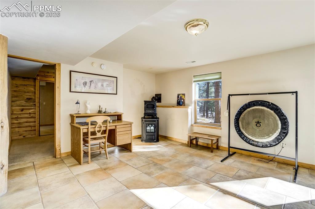 Image 30 of 45: The walk-out basement includes a family room, bedroom with adjoining sittin