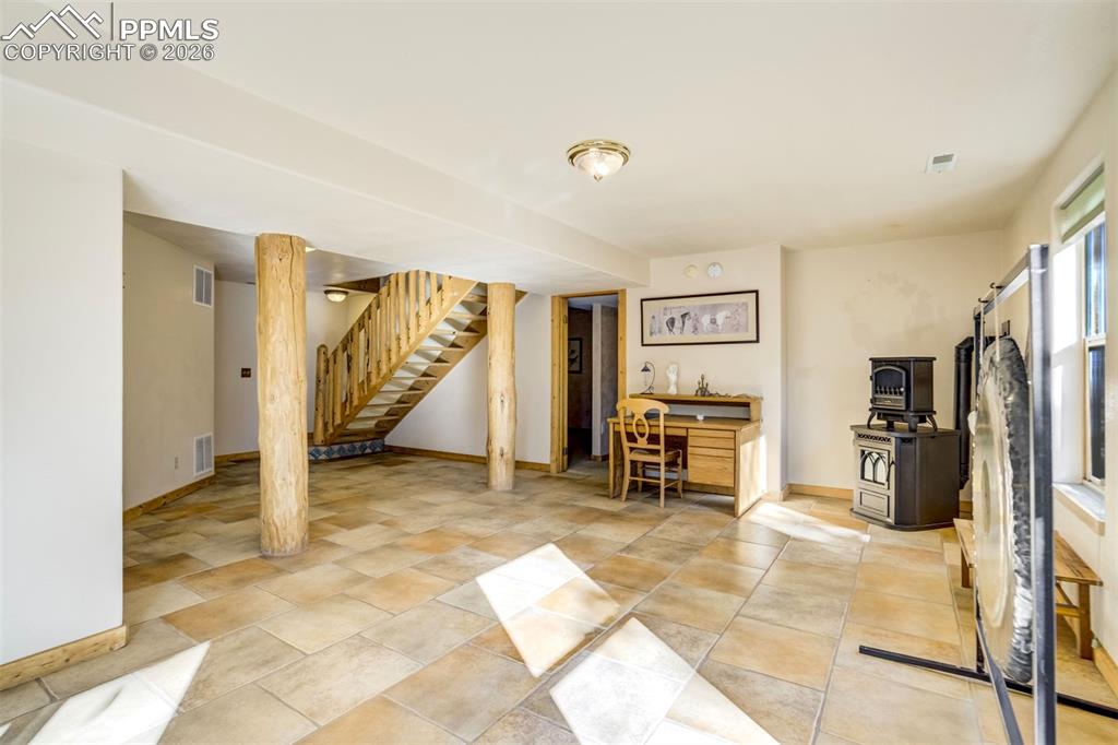 Image 31 of 45: The walk-out basement includes a family room, bedroom with adjoining sittin