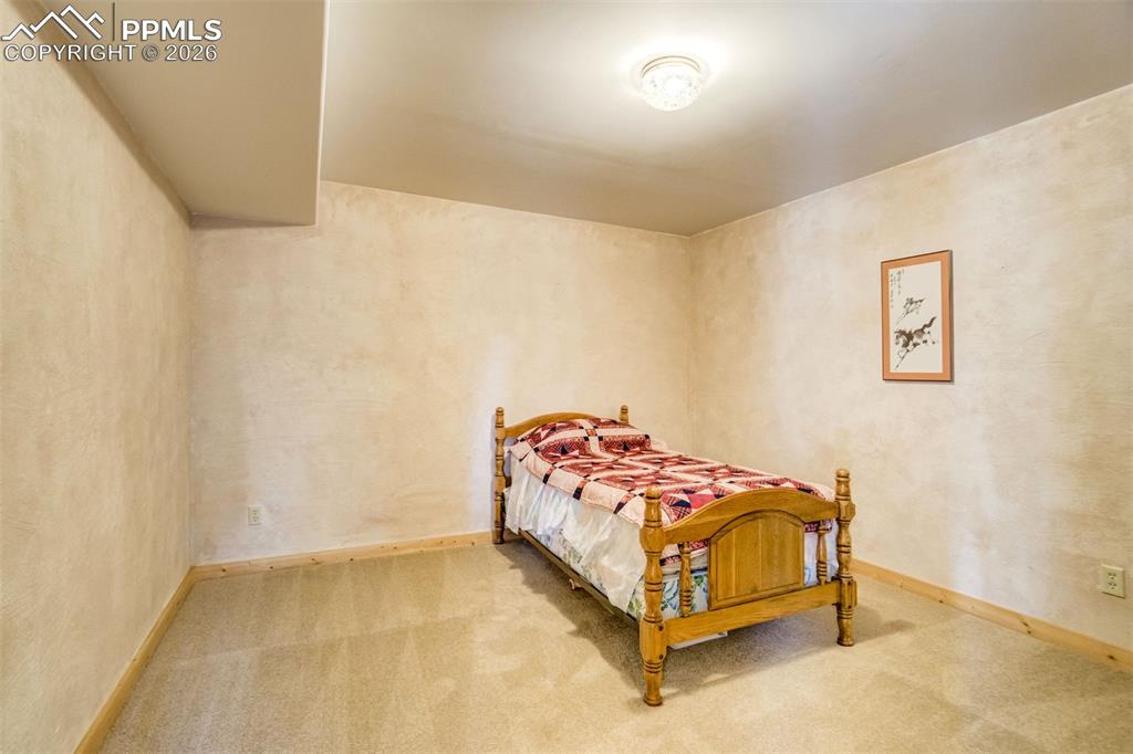 Image 32 of 45: Basement bedroom Carpeted featuring sitting room and ensuite bathroom