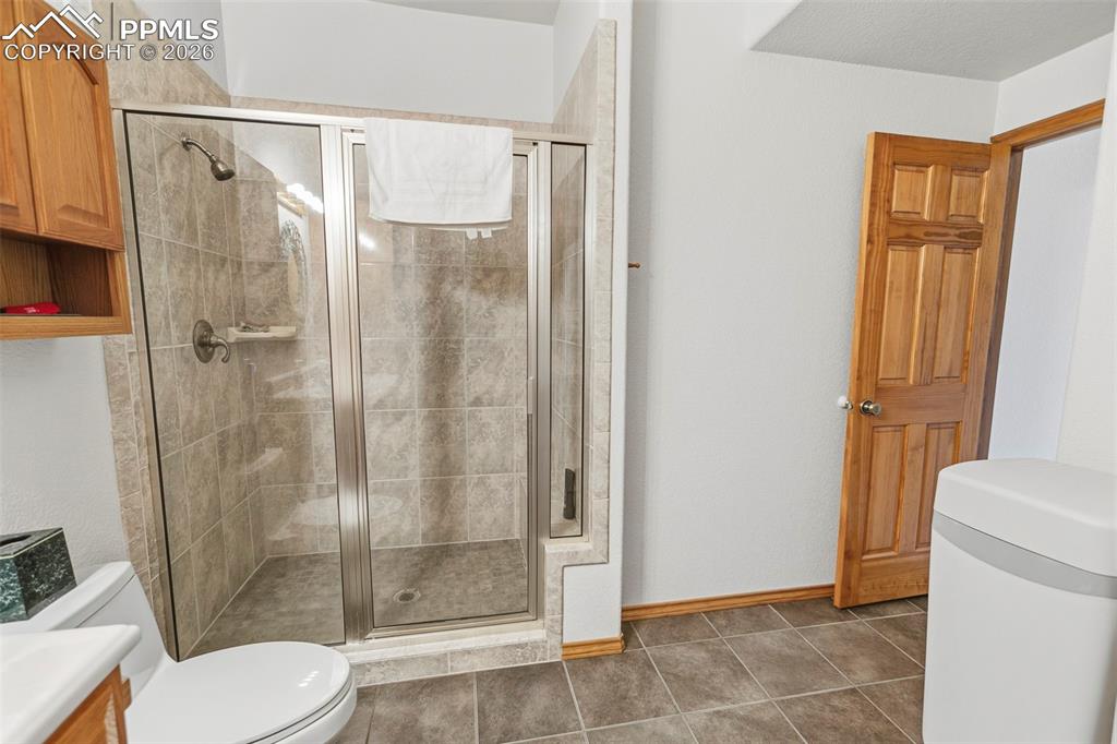 Image 22 of 28: Lower Level Bath and Laundry