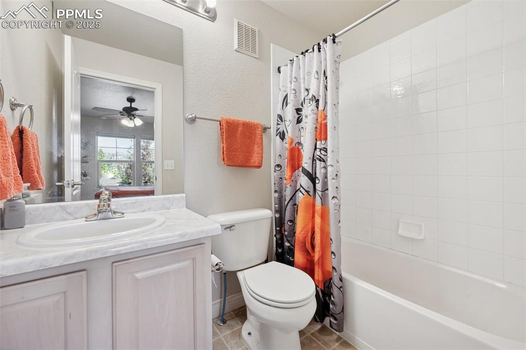 Image 13 of 37: Upper level full bathroom attached to secondary bedroom. 