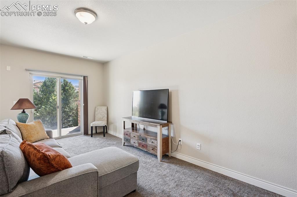Image 16 of 37: Basement family room with walk out patio 