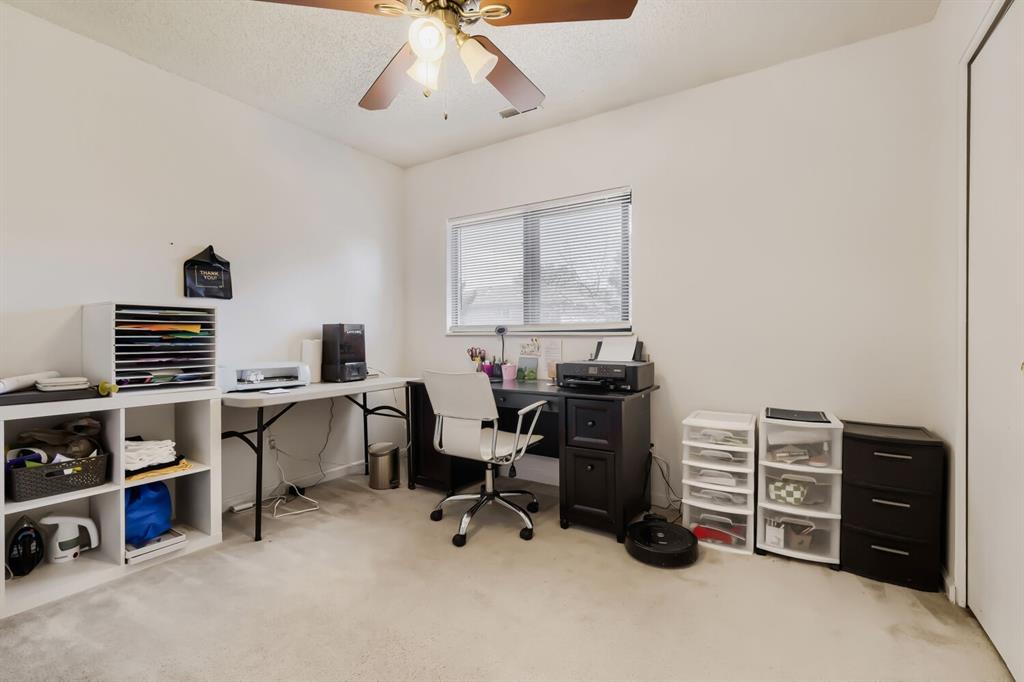 Image 6 of 22: Recessed window with blinds, ceiling fan with light fixture, light-toned ca