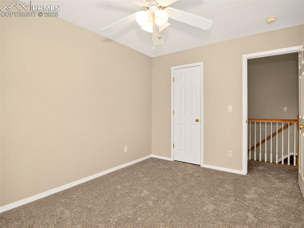 Image 18 of 27: Unfurnished bedroom featuring carpet and a ceiling fan