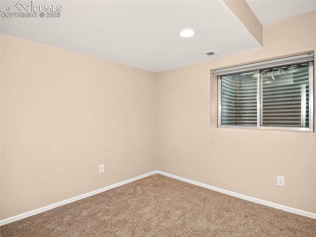 Image 25 of 27: Spare room with carpet flooring and recessed lighting