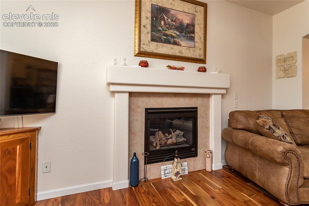 Image 10 of 44: Relax on chilly winter nights by the cozy main-level gas fireplace, beautif