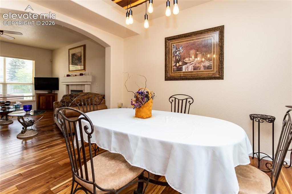 Image 12 of 44: This versatile dining area acts as the heart of the home, effortlessly conn