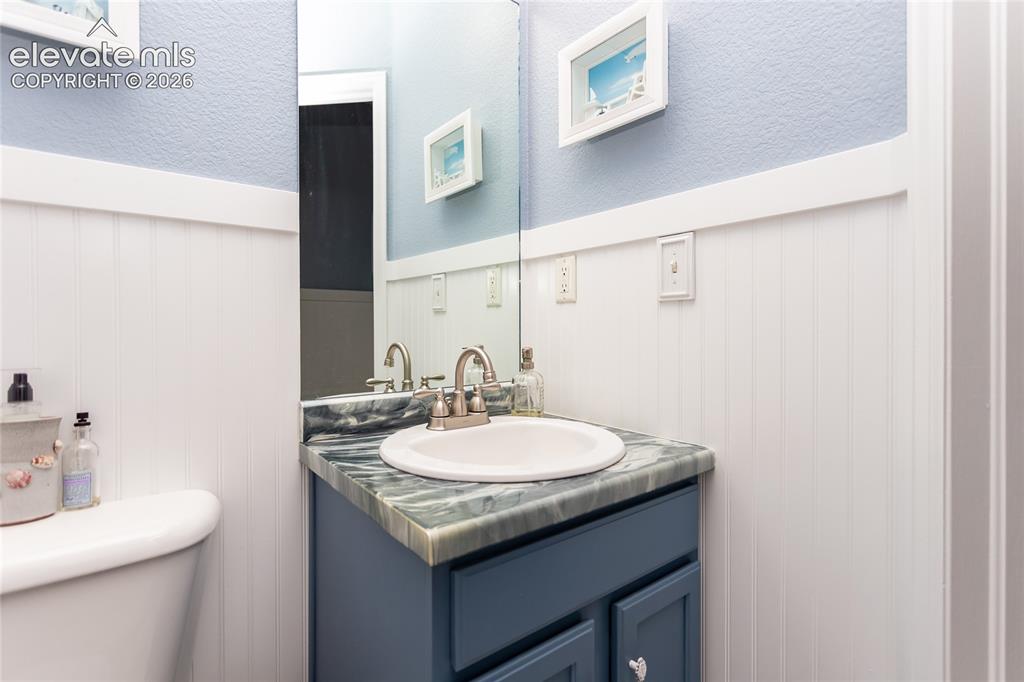 Image 21 of 44: Every bathroom in this home stands out with custom, hand-crafted countertop