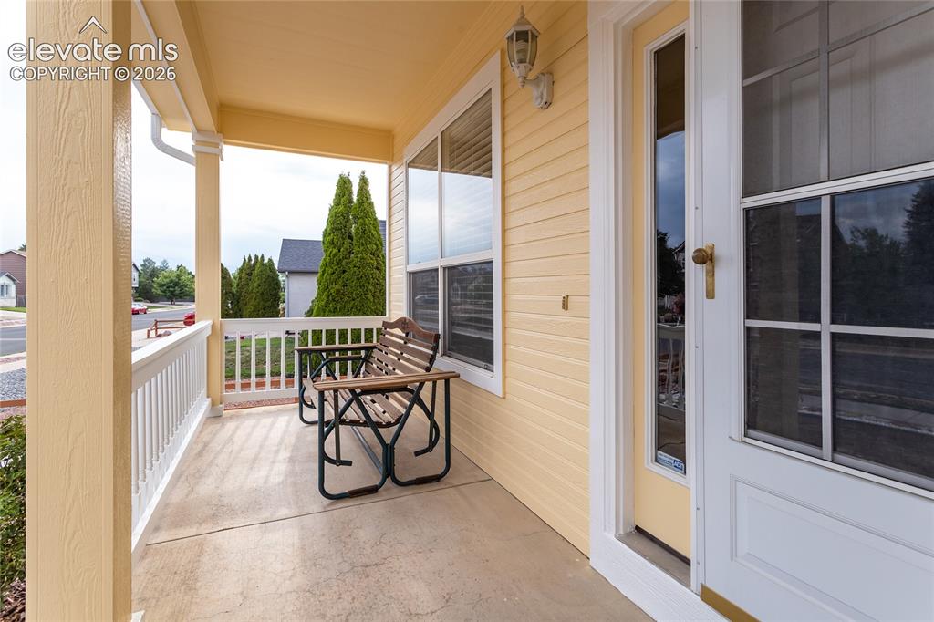 Image 4 of 44: The clean lines of the freshly painted exterior and the inviting storm door