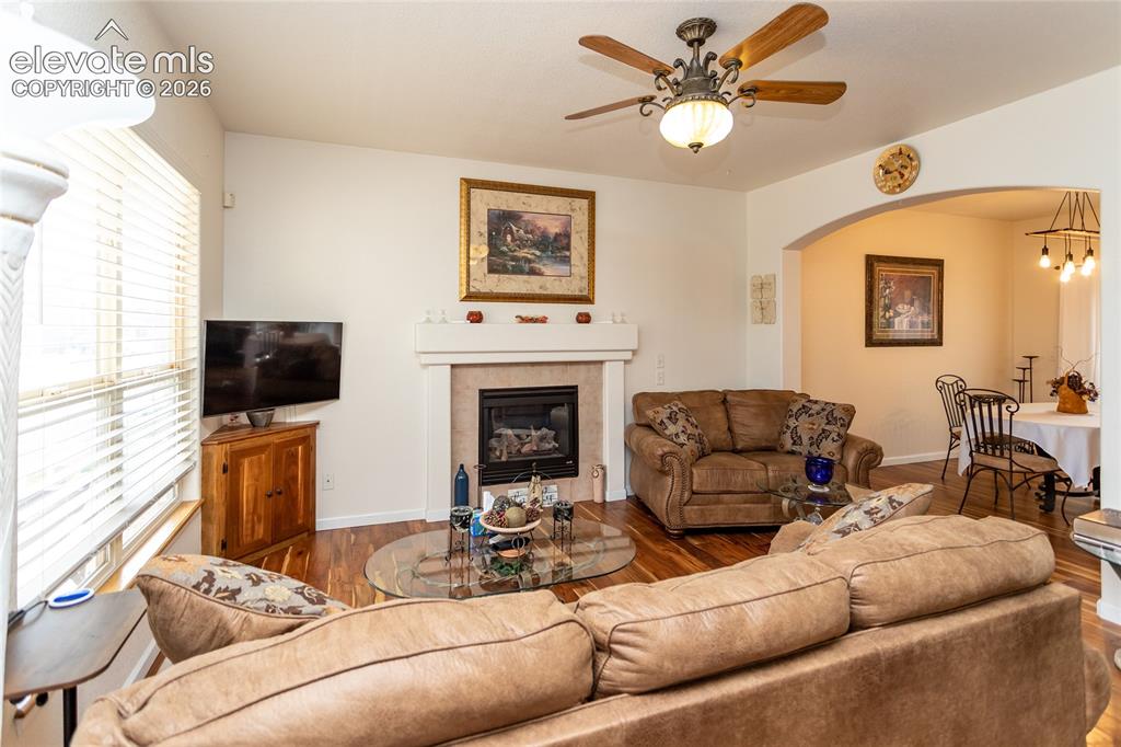 Image 5 of 44: Large windows draw in abundant Colorado sunlight, making this open main-lev