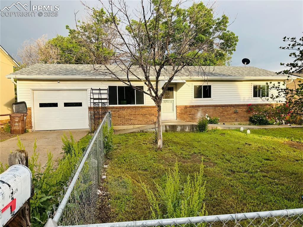 Image 3 of 17: Single story home featuring brick siding, driveway, and a garage