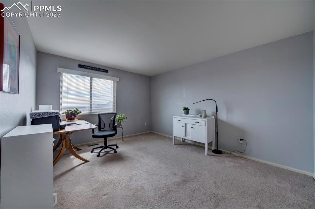 Image 22 of 44: 2nd bedroom/Office featuring carpet and baseboards 