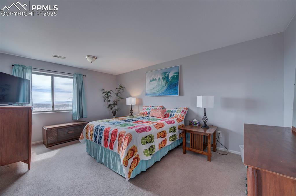 Image 28 of 44: basement Bedroom with light colored carpet