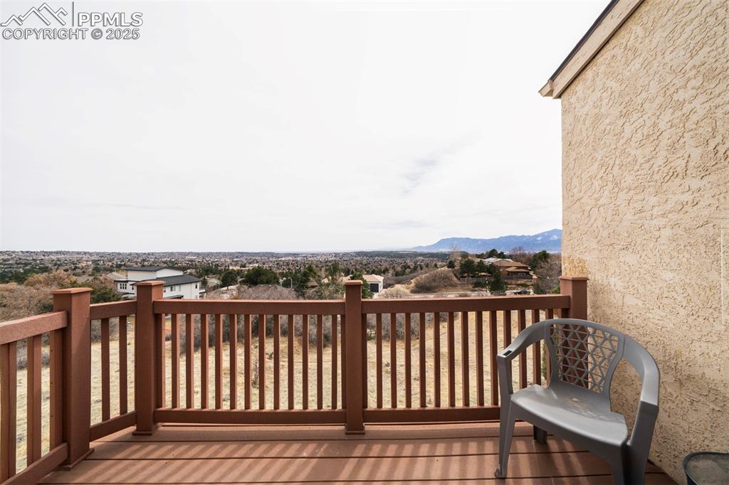 Image 36 of 44:  Unobstructed View of wooden deck from master bedroom