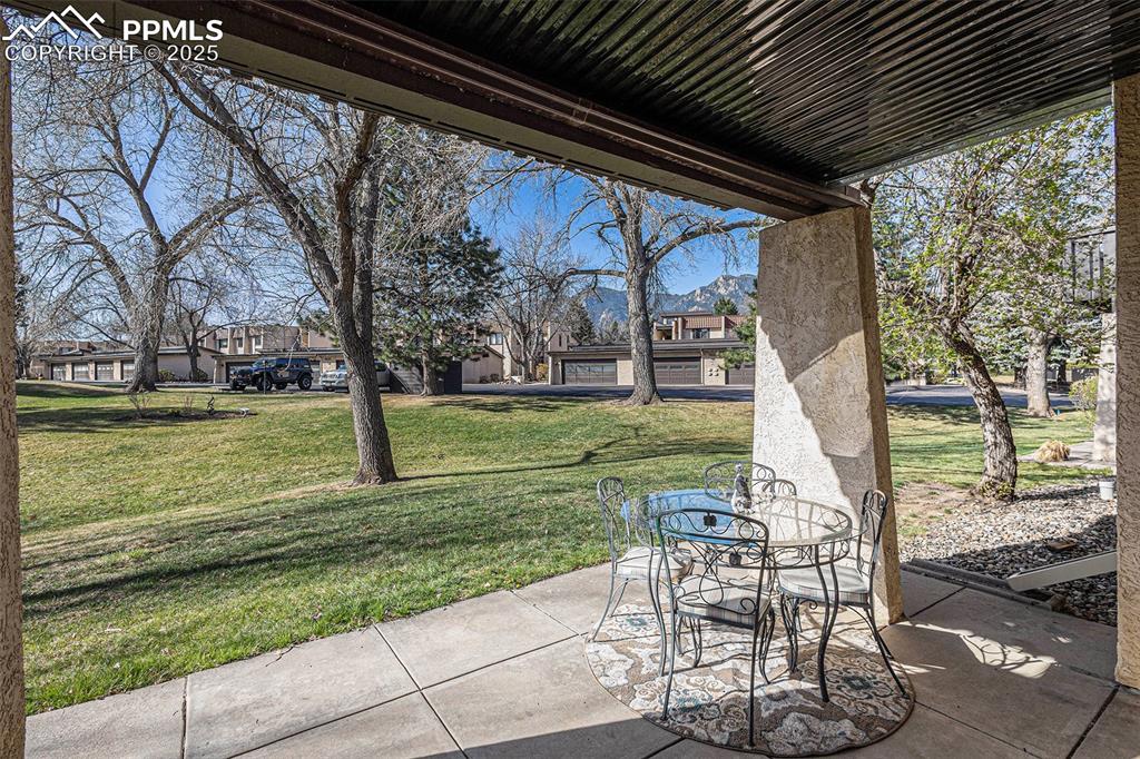 Image 6 of 33: From the patio, enjoy a picturesque view of the open , park-like green spac