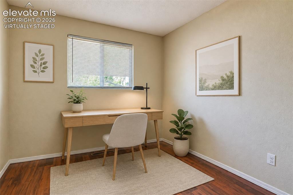 Image 27 of 35: Virtually staged Versatile room featuring wood-finish flooring, a window wi