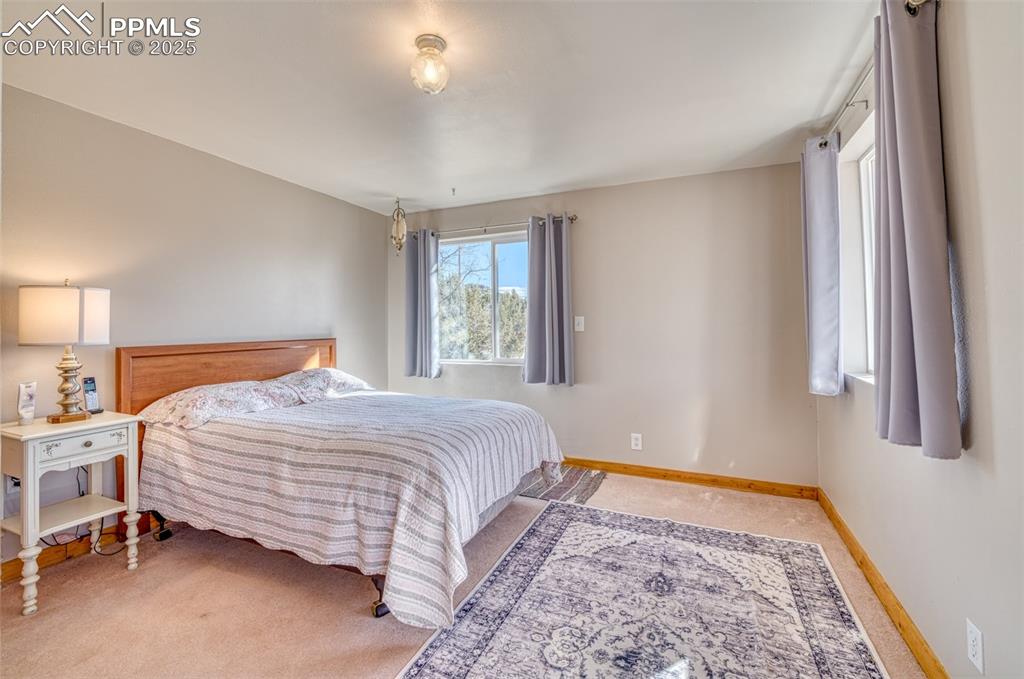 Image 17 of 45: Bedroom featuring carpet floors and baseboards