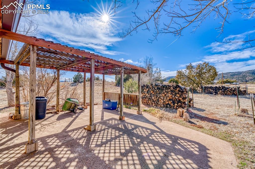 Image 27 of 45: View of patio / terrace with a pergola