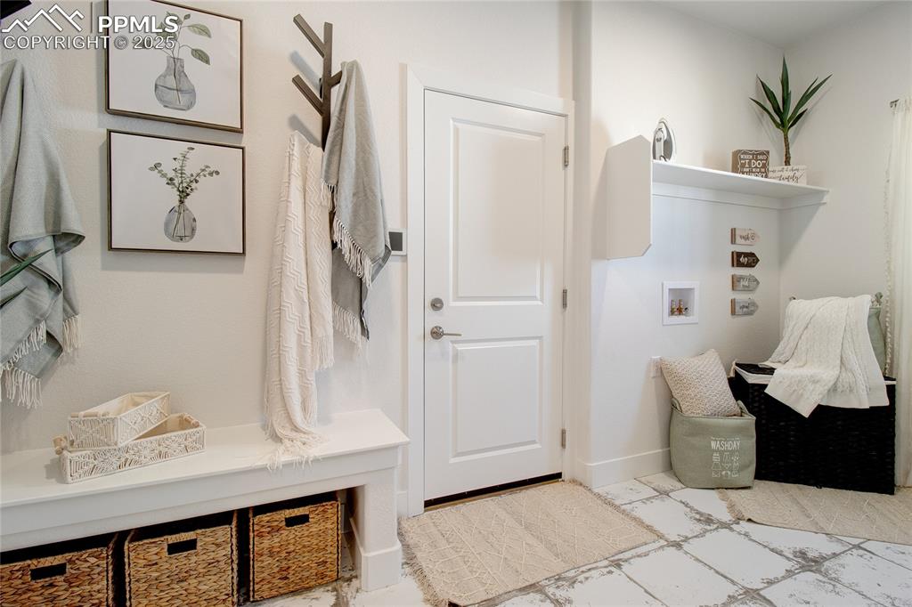 Image 11 of 27: Mudroom featuring baseboards