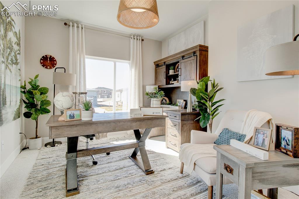 Image 13 of 27: Office space with light colored carpet