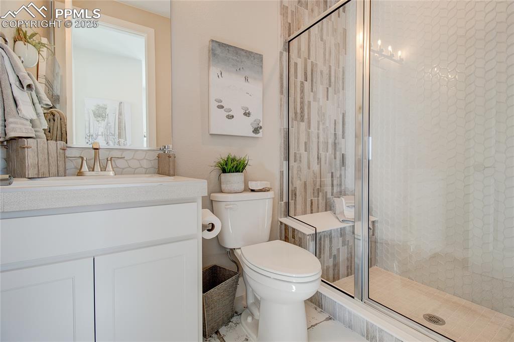 Image 14 of 27: Full bath featuring vanity and a stall shower