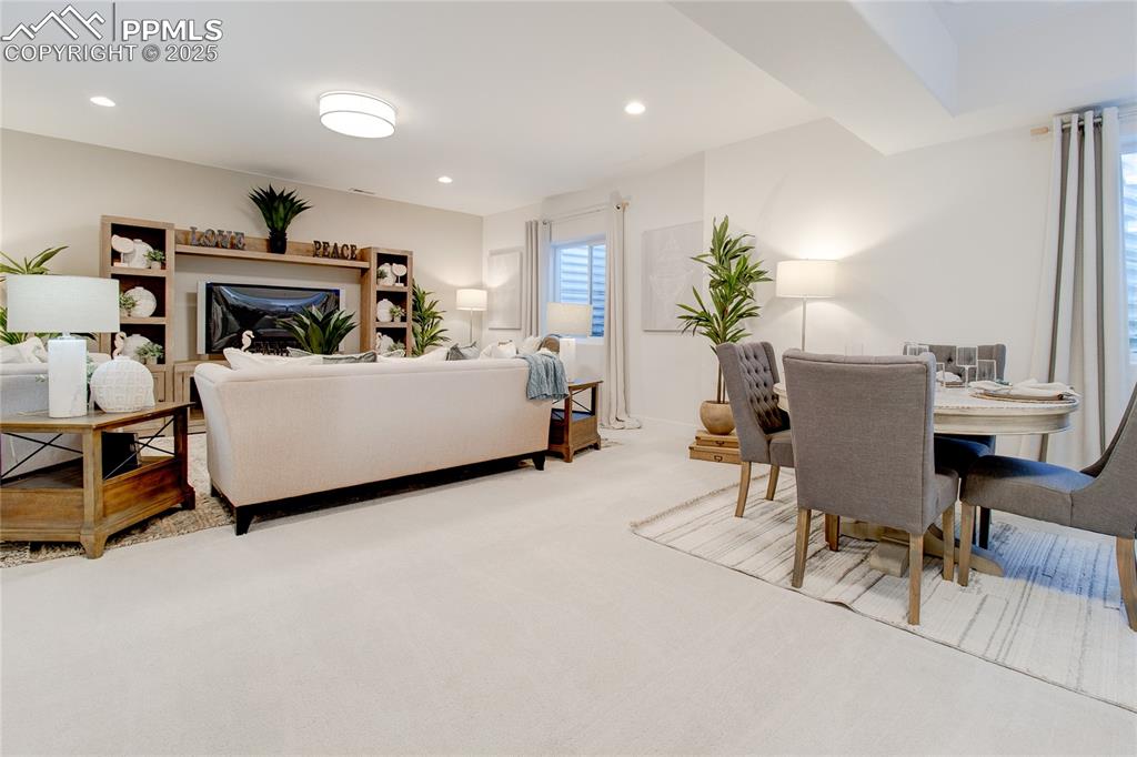 Image 22 of 27: Living area featuring carpet and recessed lighting