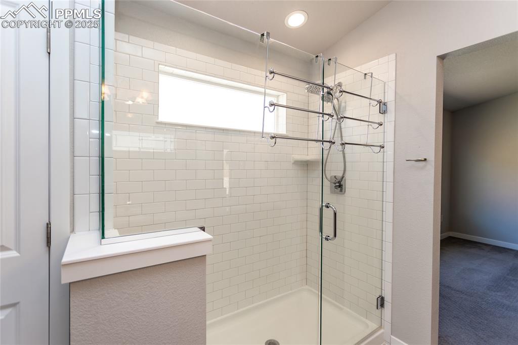 Image 19 of 38: Spa Style Shower in Master Bath