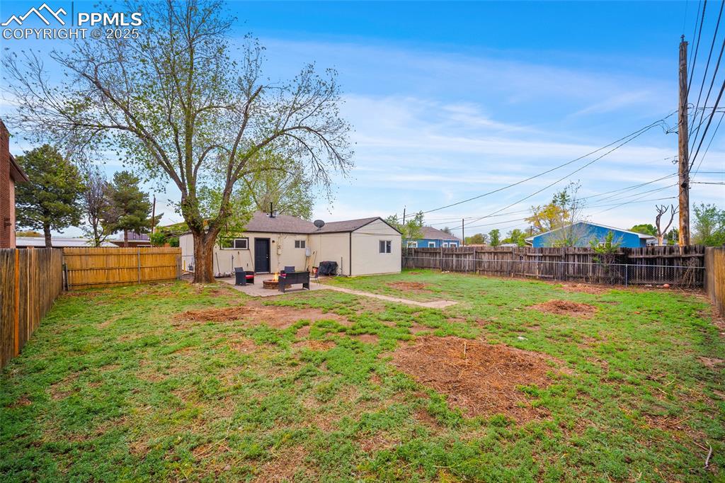Image 11 of 12: View of yard featuring a patio area