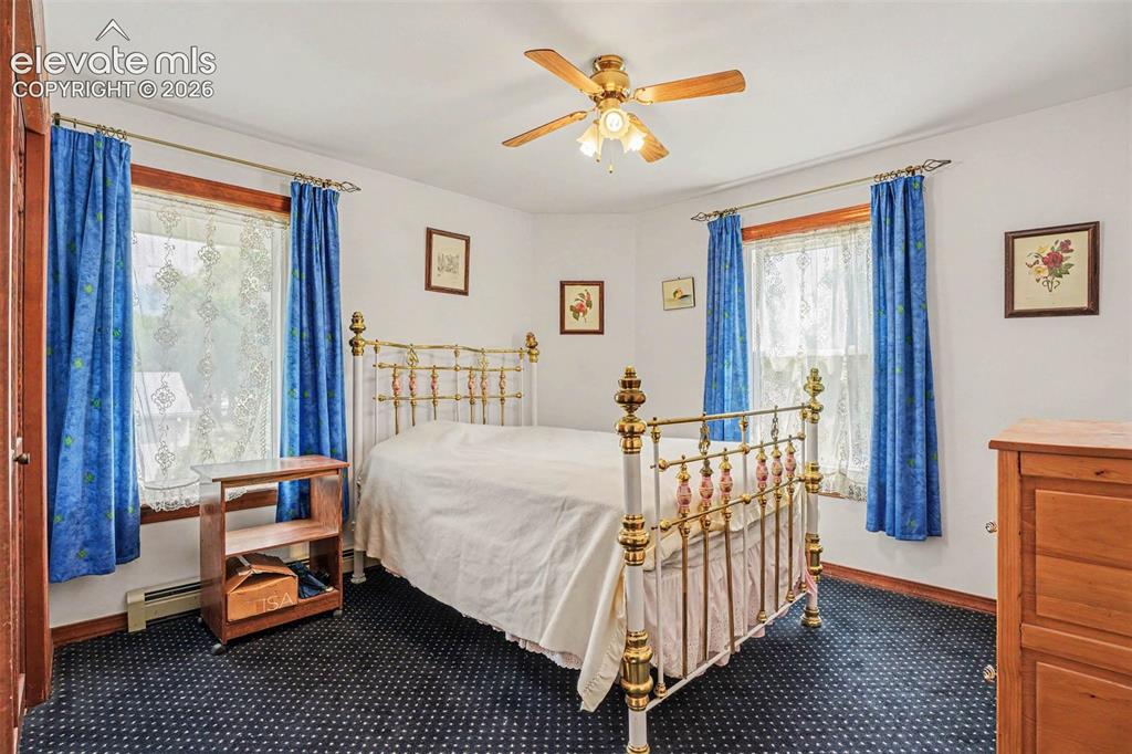 Image 17 of 27: Freshly-painted interior room featuring a ceiling fan with integrated light