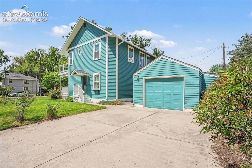Image 26 of 27: Another angle of this fabulous residence features attractive teal siding ac