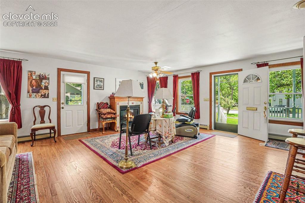 Image 8 of 27: Bright interior space featuring wood-finish flooring