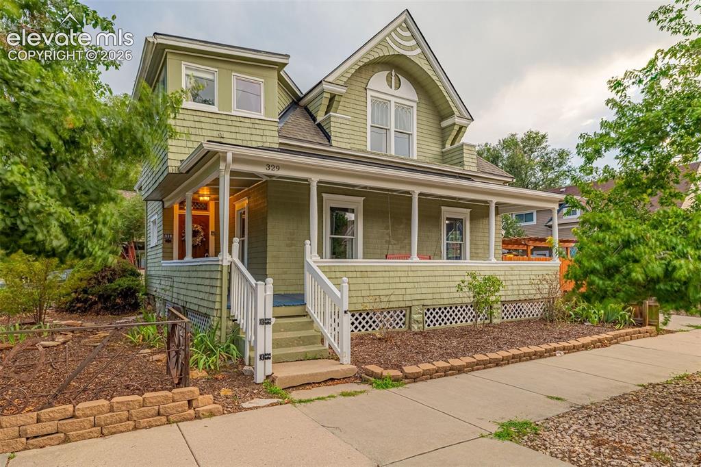 Image 1 of 33: Classic Late Victorian-style residence featuring a steeply pitched gable ro