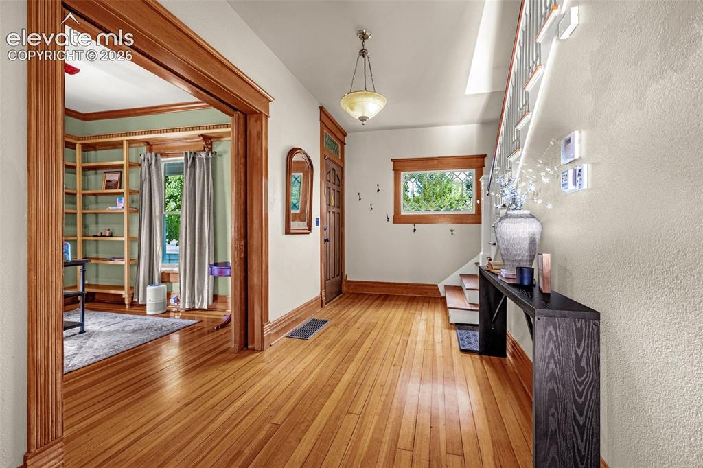 Image 3 of 33: Open entry hallway with access to living and office area