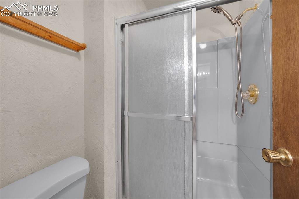 Image 34 of 47:  featuring a stall shower