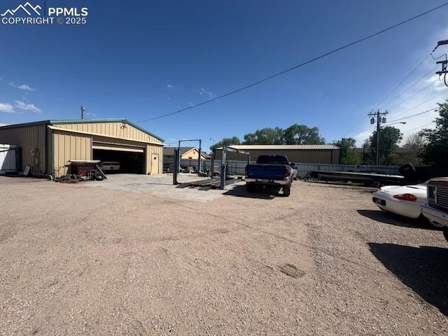 Image 2 of 10: exterior building/garage 