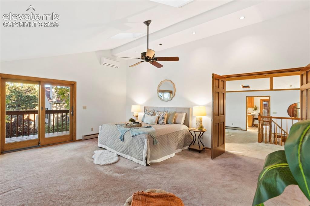 Image 17 of 47: Vaulted ceiling with recessed lighting, central ceiling fan, sliding glass 