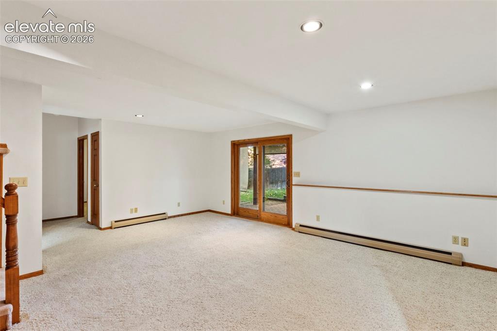 Image 29 of 47: Interior space featuring wall-to-wall carpeting, recessed ceiling lighting,