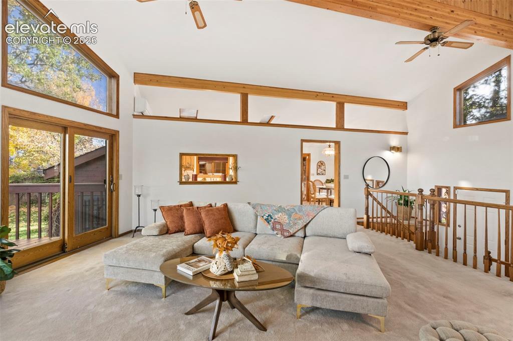 Image 9 of 47: Vaulted ceilings with exposed timber beams, expansive clerestory windows, s