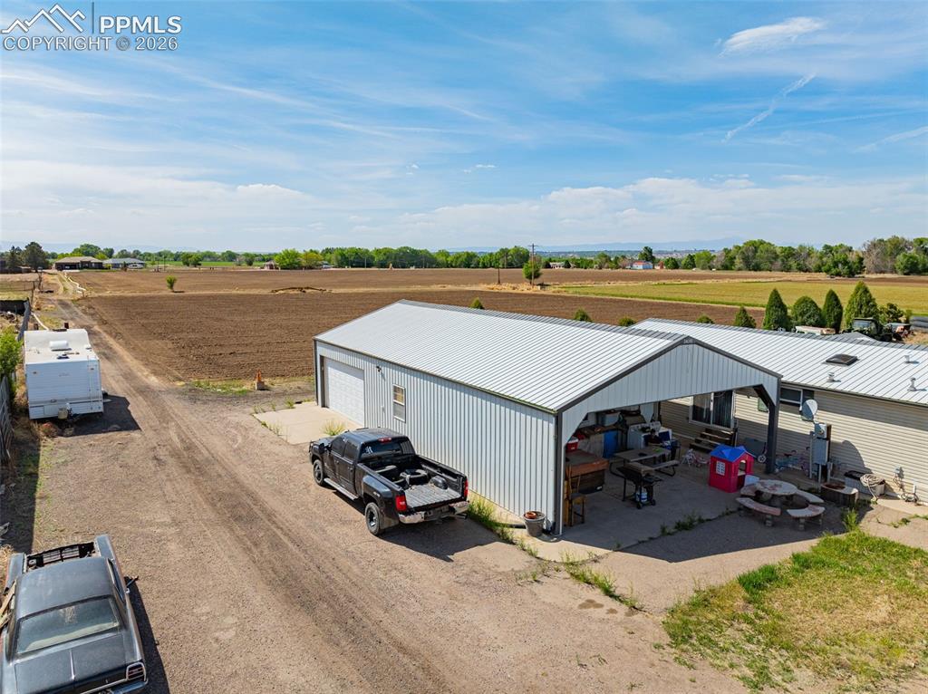 Image 12 of 20: 30x60 finished garage w/ carport
