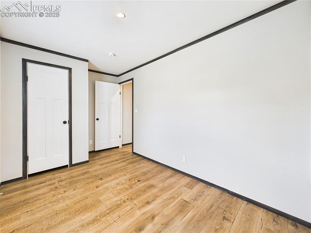 Image 29 of 39: Bedroom 3 – Additional bedroom with closets and recessed lighting, offering