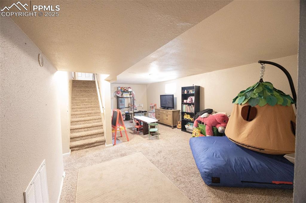 Image 12 of 21: Basement bathroom with NEW carpet